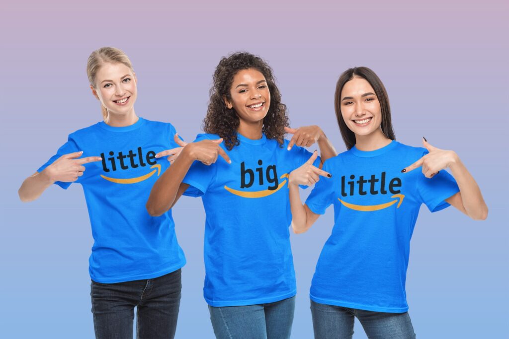 three teenager girls pointing at her Tshirts