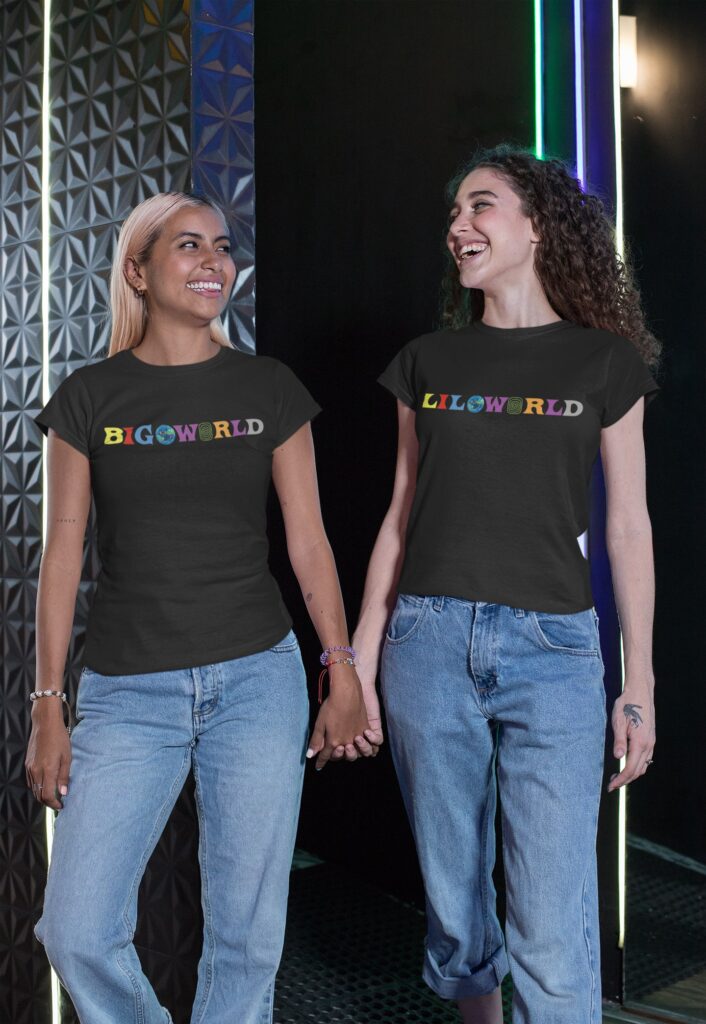 two friends wearing matching tees and holding hands