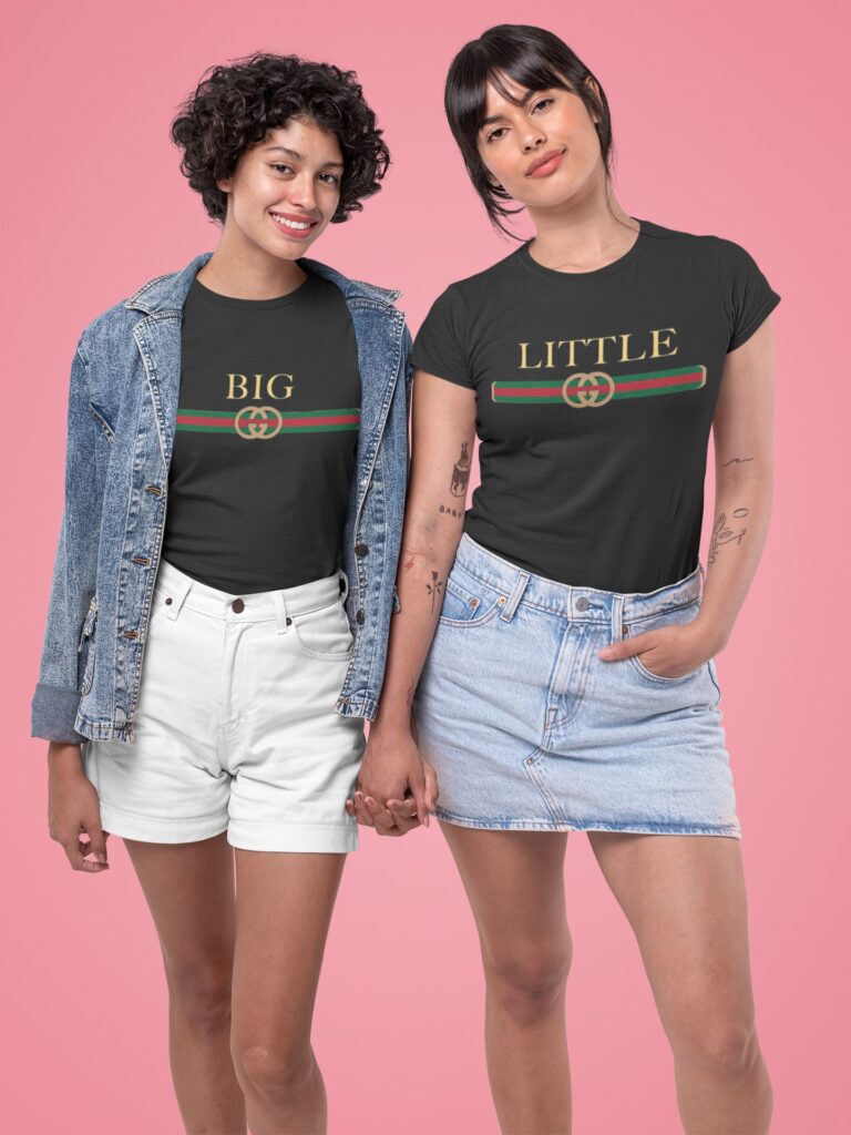 two stylish girl in same tshirts holding hand at a studio