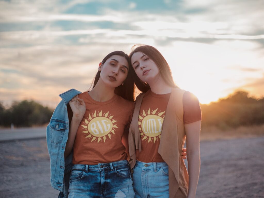 Two Pretty Girls Posing in same tshirts with denim outfits outdoor
