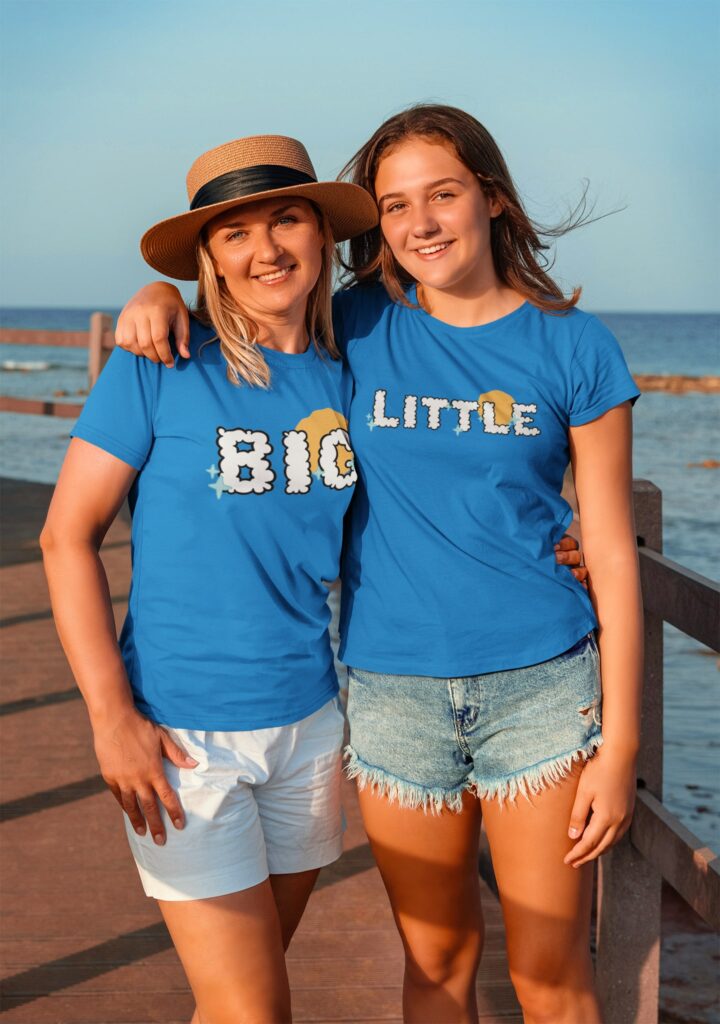 Mom Hugging her teenage daughter at the beach
