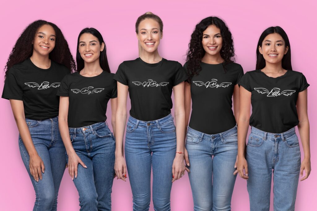 Tshirt mockup of five woman smiling in a studio