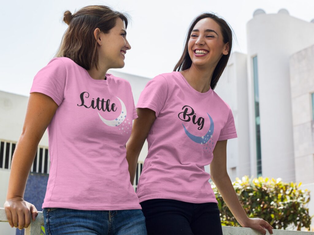 Two Girl talking In garden wearing round neck tee